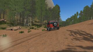 WILD DIRT RALLYのゲーム画面「バンクのついた土の斜面を登る」