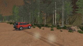 WILD DIRT RALLYのゲーム画面「林の中を走る赤い車」